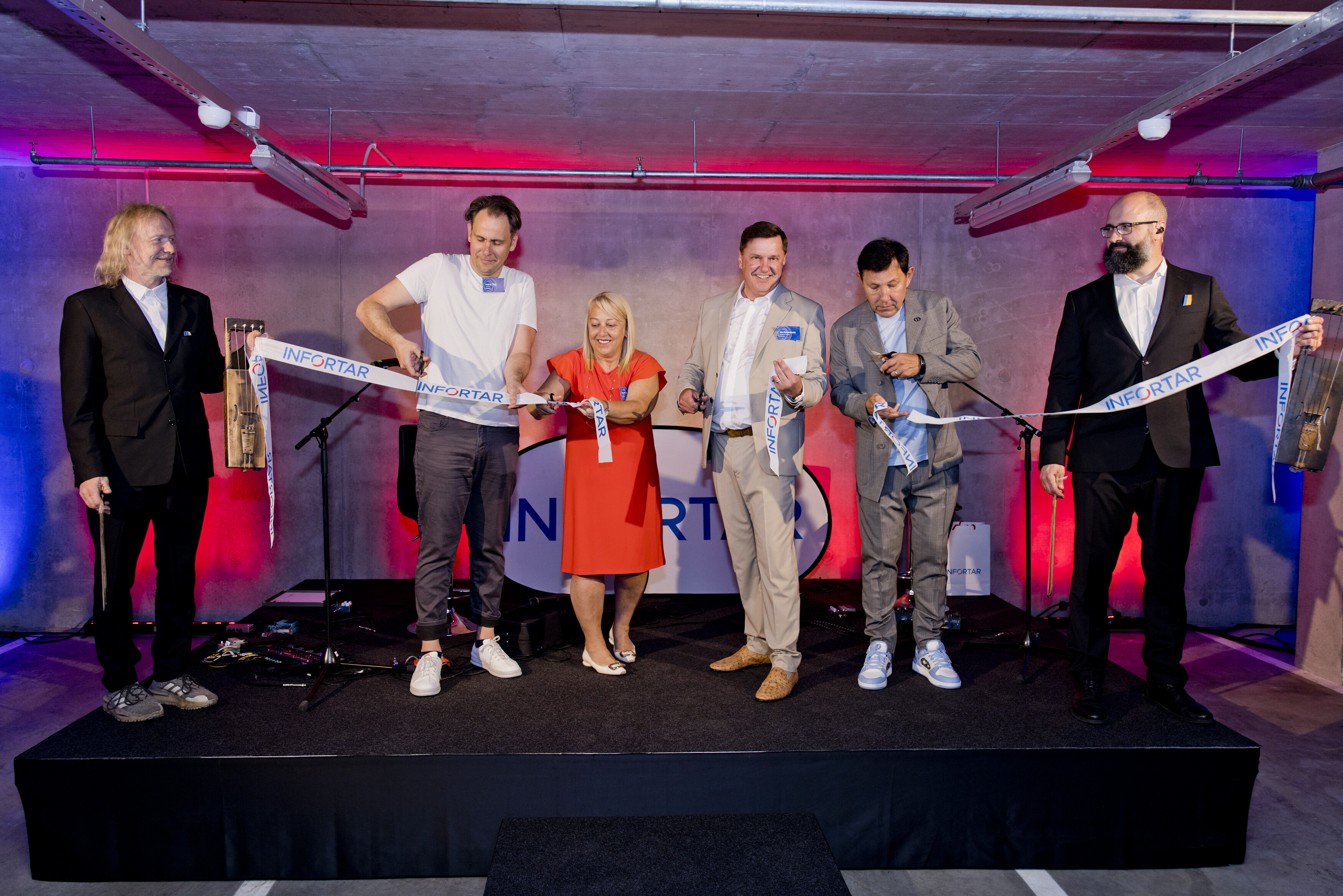 The opening ribbon, held by Puuluup members Ramo Teder and Marko Veisson, is being cut by architect Indrek Tiigi, Infortar management board members Eve Pant and Ain Hanschmidt, and chairman of the supervisory board Enn Pant.